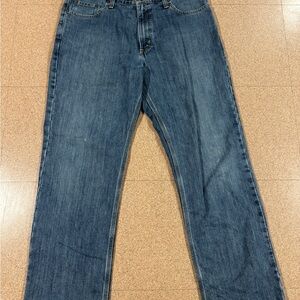 Carhartt Relaxed Fit Jeans in a versatile medium wash, size on tag 36x32